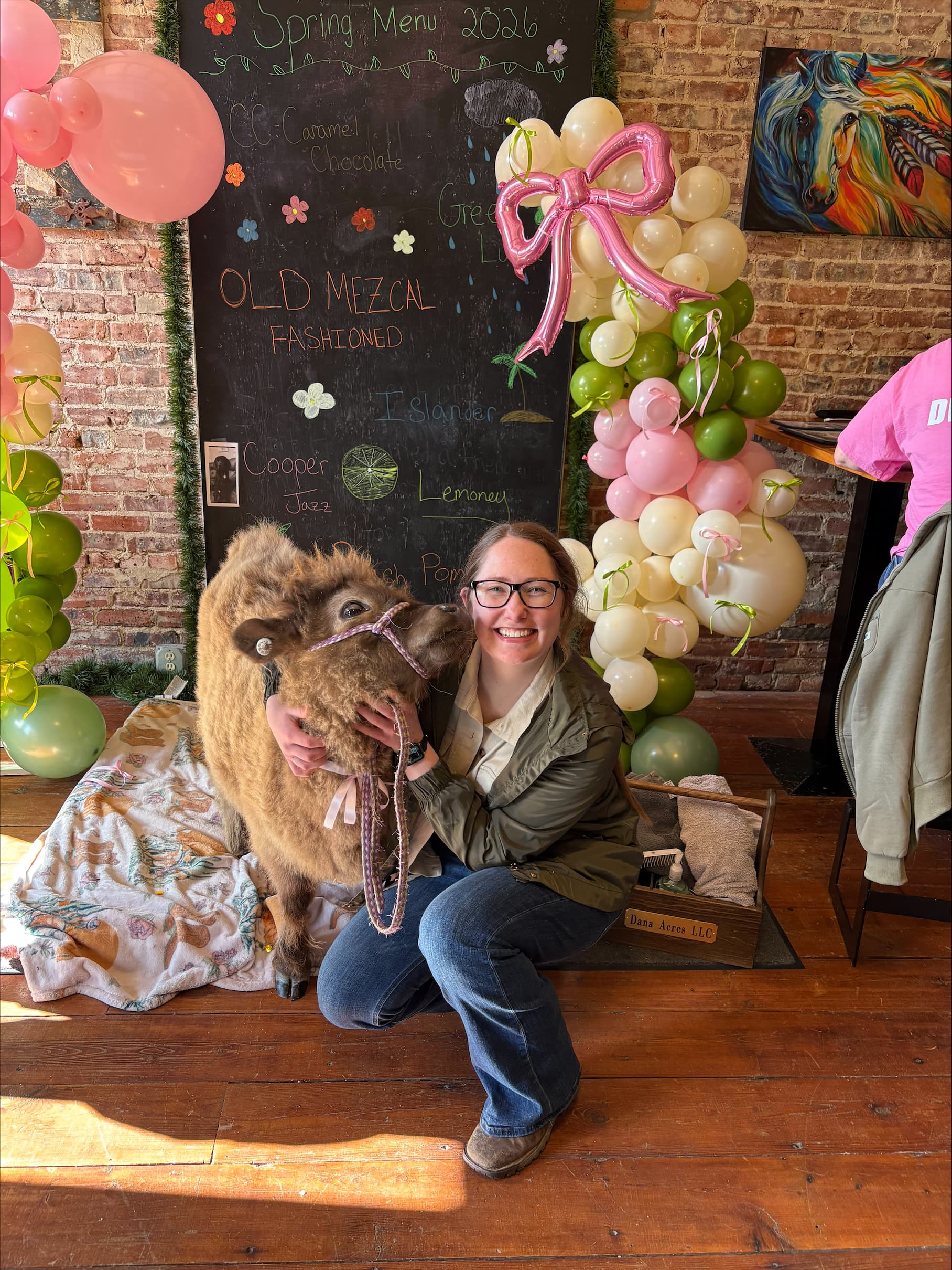 Dana with animals at Dana Acres
